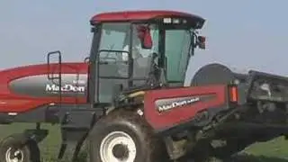 MacDon M150 SP Windrower Tractor Drive-by in reverse