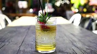 Liquid Being Poured Into A Glass Of Iced Drink