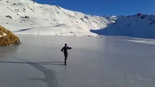 Skating on frozen Lake Angelus, Nelson Lakes National Park.