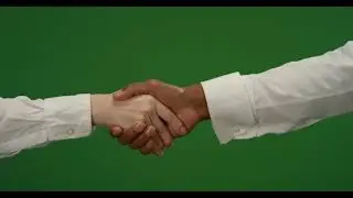 CU Two people shake hands on green screen