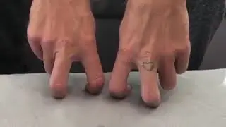 Chris Martin helping out with the hand choreography for E Lo