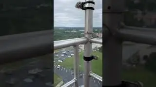 Watching helicopters from the top of a Ferris wheel