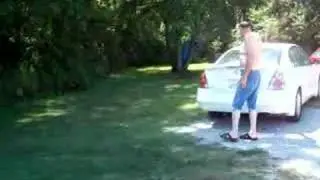 Dad Outside Pointing at my car :)