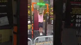 Trying to win $200 prize holding bar for 120 seconds