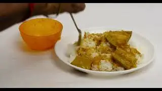 Mango gravy served with rice woman serving indian