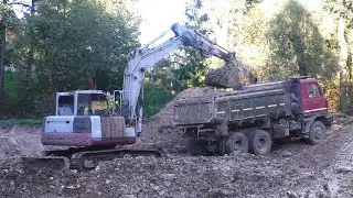 Компактный экскаватор Takeuchi TB 1140 копает пруд часть 1