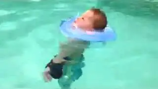 Xander swimming with arm weights