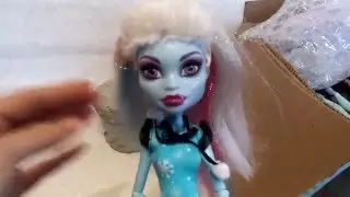 Unpacking a parcel from Monster High.