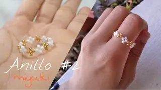 Ring woven with beads in the shape of little crosses - Diy Cute