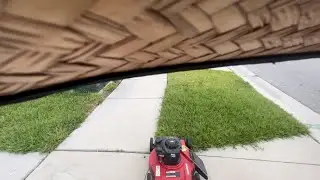Mowing a yard in the neighborhood | Florida Lawn