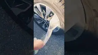 Peeling plastics off of newly arrived vehicles.