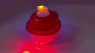 Игрушка заводная Юла музыкальная