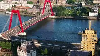 Vibrant Willemsbrug bridge over Nieuwe Maas, modern architecture, and scenic waterways of Rotterdam