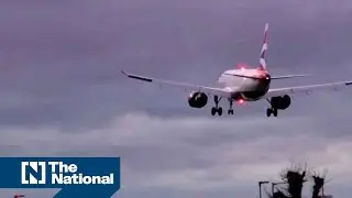 Planes sway as they land in London during Storm Henk