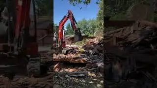 Excavators Munching on A House