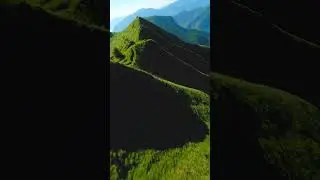 FPV Drone surfing through the mountains