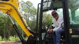 The stumps are gone/the ditch is dug! Big EXCAVATOR makes for light work!