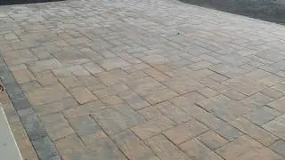 Hanover Outdoor Living Area featuring patio, fire pit,  seating wall- Ryan's Landscaping