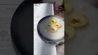 Farzi Green mango Amuse in a pani puri shell with chopped green apple on the top