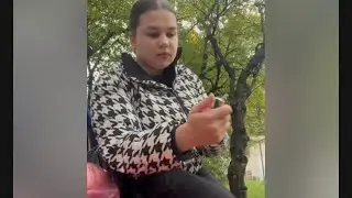 girl smoking on the bench outside spitting and crush her cigarette FULL VIDEO