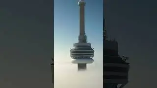 Circling The CN Tower Above The Clouds