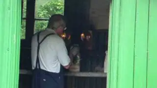 Ropley lampman services paraffin signal lamps in his shed (Mid Hants Railway, UK)