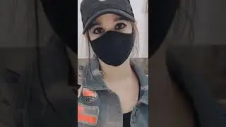 Cute girl with mask and cap lovely girl eye contact