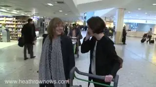 A long way from Downton Abbey as actresses arrive at Heathrow