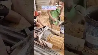 Making concrete blocks: people making concrete blocks