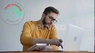 Young Man Takes Notes in a Notebook at the Office   Stock Footage   Videohive