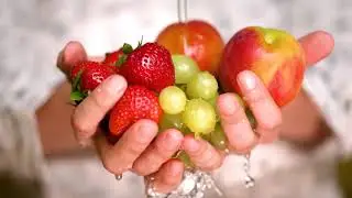Rinsing strawberries,apples and grapes holding hands bugs in strawberries, strawberries in saltwater