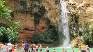 Trail and Waterfalls at Cueva Del Turche, Valenciana and abseilers abseiling down the waterfall.