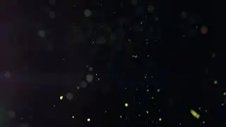 Glittering Sparkling Particles spin in the air with Bokeh