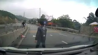 Baby crawling across major road in Vietnam lucky not to be hit by cars