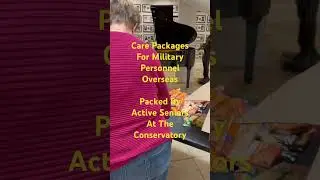 Active seniors at the Conservatory packing care packages for our military overseas.