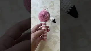 Pink flamingo rattle toy for newborn baby. Flamingo theme baby shower.