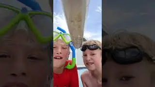 brothers at swimming pool doing a challenge