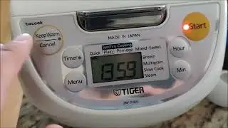 Tiger Rice Cooker from Costco. You know it's done when Cook light switches over to Warm light (left)