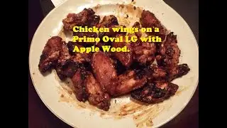 Chicken wings over apple wood on a Primo Large Grill