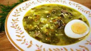 Green cabbage soup with sorrel and egg