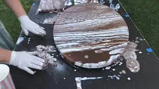 Acrylic pouring with mirror effect spray paint.