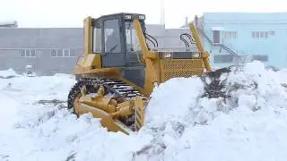 The work of a bulldozer TM.10 in winter conditions