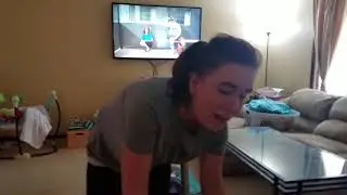 Krystal vacuuming the couch