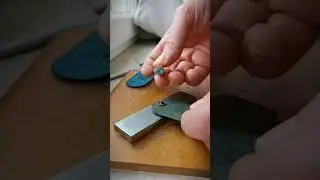 How to punch a snap button by hand with some leathercraft tool and some elbow grease.