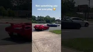 Lamborghini Countach driving in traffic