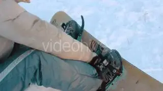 Snowboarder Securing Fasteners
