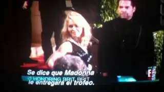 Madonna is giving the award to britney at the VMA'S 2011