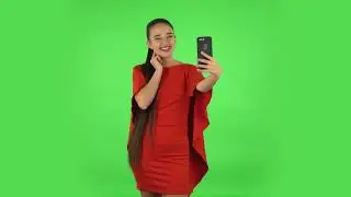 Pretty Young Woman Is Making Selfie on Mobile Phone Then Looking Photos  Green Screen No Copyright