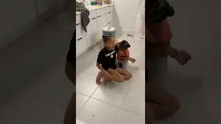 Dad catches little sister biting big sister 