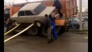 How not to unload a car from a truck